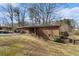 Brick house featuring a fenced backyard with a covered swimming pool at 3806 Lindley Cir, Powder Springs, GA 30127