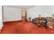 Spacious room with wood trim, red carpet, and light walls at 3806 Lindley Cir, Powder Springs, GA 30127