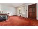 Cozy living room with a large dark wooden door and window with white sheer curtains at 3806 Lindley Cir, Powder Springs, GA 30127