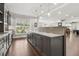 Custom bar area featuring dark cabinetry, granite counters and wood flooring at 4434 Oglethorpe Nw Loop, Acworth, GA 30101