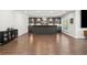 Stylish bar area with dark cabinetry, open shelving and plenty of storage at 4434 Oglethorpe Nw Loop, Acworth, GA 30101