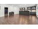 Attractive bar area featuring dark cabinetry, open shelving and wood flooring at 4434 Oglethorpe Nw Loop, Acworth, GA 30101