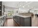 Stylish wet bar with gray cabinets, quartz countertops, designer fixtures, and a view of the property at 4434 Oglethorpe Nw Loop, Acworth, GA 30101