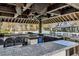 Granite counter at outdoor bar includes beer taps overlooking a pool and wooded area at 4434 Oglethorpe Nw Loop, Acworth, GA 30101