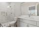 Bathroom featuring a glass shower, white cabinets, and a large mirror at 4434 Oglethorpe Nw Loop, Acworth, GA 30101