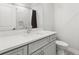 Bathroom featuring grey vanity with chrome hardware and marble tile in the shower at 4434 Oglethorpe Nw Loop, Acworth, GA 30101