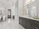 Elegant bathroom featuring marble floors, dark cabinetry, and a glass-enclosed shower at 4434 Oglethorpe Nw Loop, Acworth, GA 30101