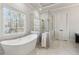 Stylish bathroom featuring a freestanding tub and a glass-enclosed shower with marble accents at 4434 Oglethorpe Nw Loop, Acworth, GA 30101