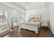 Bright bedroom with tray ceiling, hardwood floors, and a white bed at 4434 Oglethorpe Nw Loop, Acworth, GA 30101