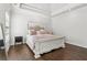 Bright bedroom featuring a king-size bed with tray ceilings and large windows for ample light at 4434 Oglethorpe Nw Loop, Acworth, GA 30101