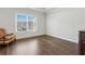 Bedroom with large window, chair, and a hardwood floor at 4434 Oglethorpe Nw Loop, Acworth, GA 30101