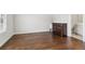 This bedroom offers dark wood floors, natural light, and access to the bathroom at 4434 Oglethorpe Nw Loop, Acworth, GA 30101