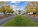 Sprawling clubhouse with stately columns, surrounded by lush greenery and mature trees at 4434 Oglethorpe Nw Loop, Acworth, GA 30101