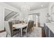 A dining room with a chandelier, and access to a staircase at 4434 Oglethorpe Nw Loop, Acworth, GA 30101