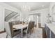 Bright dining room with chandelier, hardwood floors and view of staircase in the foyer at 4434 Oglethorpe Nw Loop, Acworth, GA 30101