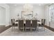 Formal dining room featuring a chandelier, hardwood floors, and seating for eight at 4434 Oglethorpe Nw Loop, Acworth, GA 30101