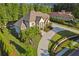 Beautiful two-story home with lush landscaping, curved driveway, and mature trees at 4434 Oglethorpe Nw Loop, Acworth, GA 30101