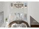 Bright two story foyer with large chandelier and windows offering natural light and elegant design at 4434 Oglethorpe Nw Loop, Acworth, GA 30101
