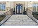 Elegant stone steps lead to the ornate, arched double front doors of the home at 4434 Oglethorpe Nw Loop, Acworth, GA 30101