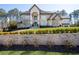 Beautiful stone-faced home with a manicured front yard and retaining wall landscaping at 4434 Oglethorpe Nw Loop, Acworth, GA 30101