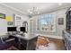 Well-lit home office with a modern desk setup, custom built-ins, and plenty of natural light at 4434 Oglethorpe Nw Loop, Acworth, GA 30101