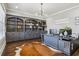 Spacious home office featuring a modern desk, custom built-ins, and a stylish cowhide rug at 4434 Oglethorpe Nw Loop, Acworth, GA 30101