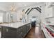 Elegant kitchen island with sink and seating area, connecting to the living space at 4434 Oglethorpe Nw Loop, Acworth, GA 30101