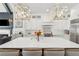 Bright kitchen with an island, pendant lighting, stainless steel appliances, and a fireplace view at 4434 Oglethorpe Nw Loop, Acworth, GA 30101