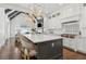 Open-concept kitchen with island seating flows into the living area, perfect for entertaining at 4434 Oglethorpe Nw Loop, Acworth, GA 30101