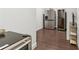 Cozy kitchenette area with wine cooler, stainless steel refrigerator, and dark wood flooring at 4434 Oglethorpe Nw Loop, Acworth, GA 30101