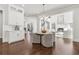 Open-concept kitchen and living room combination featuring dark hardwood floors at 4434 Oglethorpe Nw Loop, Acworth, GA 30101