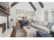 Inviting living room featuring vaulted ceilings and open floor plan to the kitchen area at 4434 Oglethorpe Nw Loop, Acworth, GA 30101