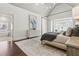 Bright main bedroom featuring a canopy bed, white walls, hardwood floors and decorative light fixture at 4434 Oglethorpe Nw Loop, Acworth, GA 30101