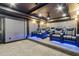 A luxury home theater room with tiered seating, plush blue leather chairs and state of the art projector system at 4434 Oglethorpe Nw Loop, Acworth, GA 30101