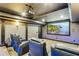 Comfortable movie room featuring projector screen, tiered seating and blue leather chairs with accent lighting at 4434 Oglethorpe Nw Loop, Acworth, GA 30101