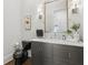 Stylish powder room features a gray vanity with marble countertop and black toilet, offering a modern touch at 4434 Oglethorpe Nw Loop, Acworth, GA 30101