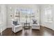 Cozy sitting area with hardwood floors, a large window, and two armchairs at 4434 Oglethorpe Nw Loop, Acworth, GA 30101