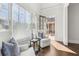 Bright sitting area featuring hardwood floors and plush chairs illuminated by natural light from large window at 4434 Oglethorpe Nw Loop, Acworth, GA 30101