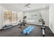 Bright workout room with large windows, exercise equipment, and a ceiling fan at 4434 Oglethorpe Nw Loop, Acworth, GA 30101