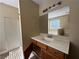 Bathroom featuring a white vanity, large mirror with vanity lighting and a separate shower at 904 Crossing Rock Dr, Lawrenceville, GA 30043