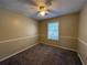 Comfortable bedroom with a ceiling fan, carpet, and neutral paint at 904 Crossing Rock Dr, Lawrenceville, GA 30043