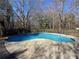 View of the in-ground swimming pool in the backyard of the property at 904 Crossing Rock Dr, Lawrenceville, GA 30043