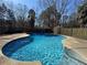 A serene in-ground pool on a sunny day, inviting relaxation and leisure at 904 Crossing Rock Dr, Lawrenceville, GA 30043