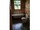 Shows a bathroom featuring old fixtures and peeling paint, highlighting the need for renovation at 1687 Neely Ave, Atlanta, GA 30344