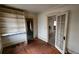 Bedroom featuring wood floors and built-in shelving at 1687 Neely Ave, Atlanta, GA 30344