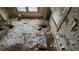 A rundown bedroom featuring significant damage, including holes in the floor and peeling walls at 1687 Neely Ave, Atlanta, GA 30344