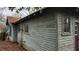 Exterior of a weathered gray house with peeling paint and original windows at 1687 Neely Ave, Atlanta, GA 30344