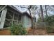 Side view of a home with weathered wood and screen porch, ready for renovation at 1687 Neely Ave, Atlanta, GA 30344