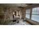 Dilapidated interior with peeling paint, reveals damaged ceiling, flooring and large windows at 1687 Neely Ave, Atlanta, GA 30344