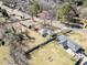 Aerial view of a residential property with mature trees and a well-maintained yard at 3606 Trickum Ne Rd, Marietta, GA 30066